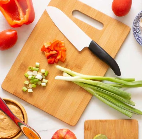 Professional chef knife on cutting board